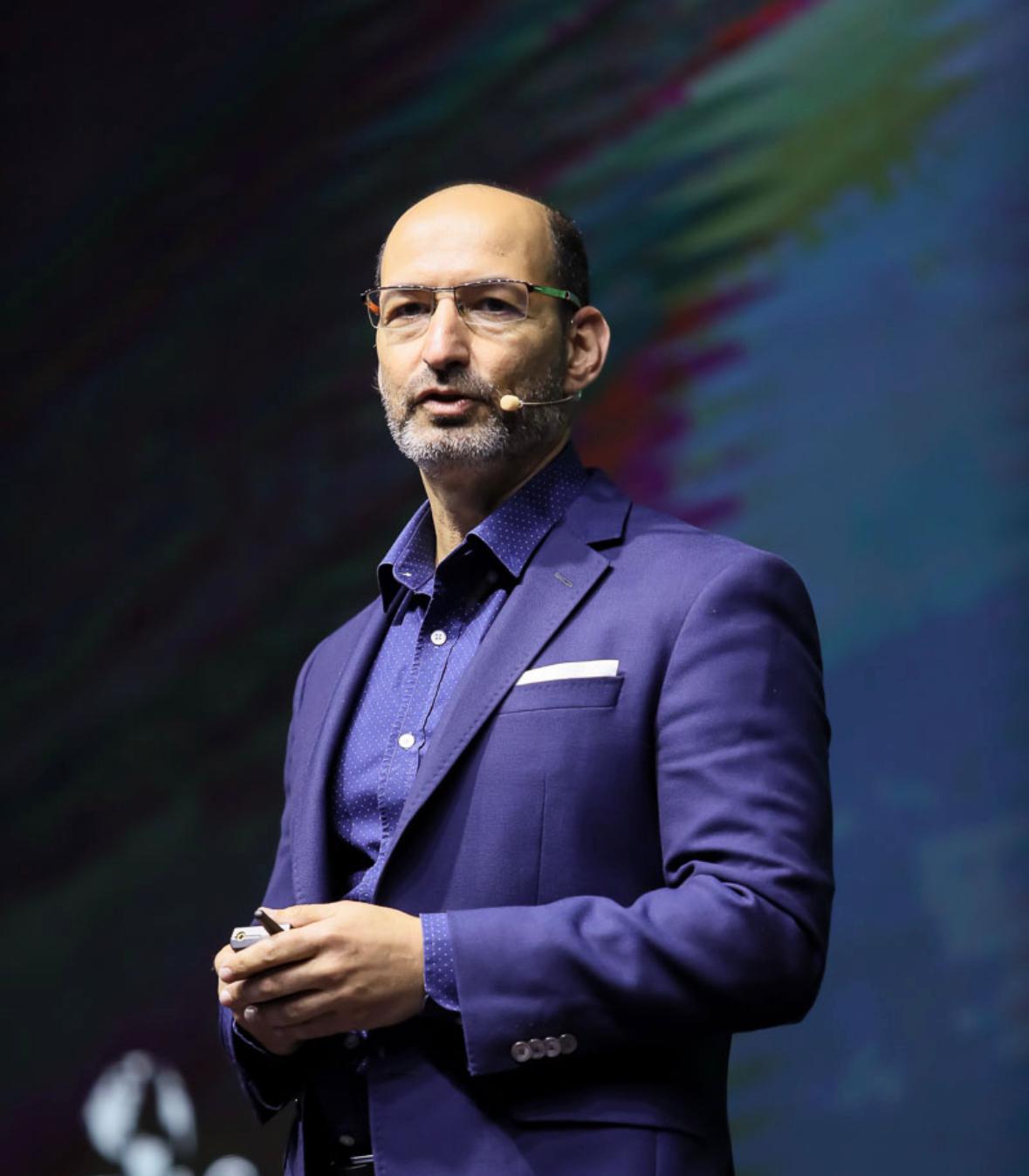 Tal Tsfany on stage — coaching and speaking